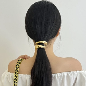 Minimalist double-layered gold metal hair tie for low ponytail with glossy finish