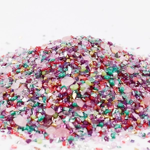 Macro shot of 2-8mm colorful irregular glass stones for DIY crafts and nail art decor