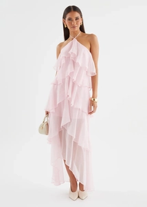 Detailed view of pink halter maxi dress featuring layered ruffles and irregular hem