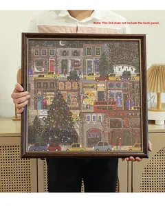 Detail of dark brown wood grain frame with gold trim featuring a Christmas scene puzzle