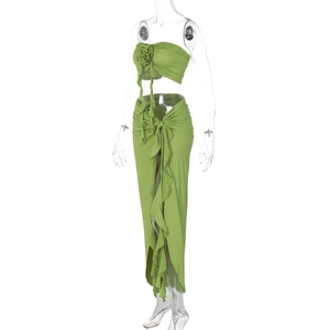 Detail of green two-piece set featuring 3D rose decoration and side slit maxi skirt