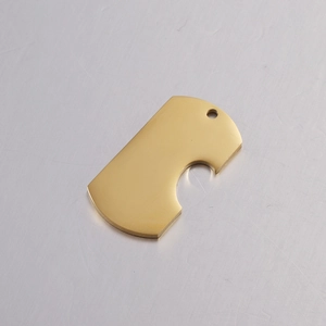 Close-up of polished gold mirror finish heart-shaped stainless steel pendant
