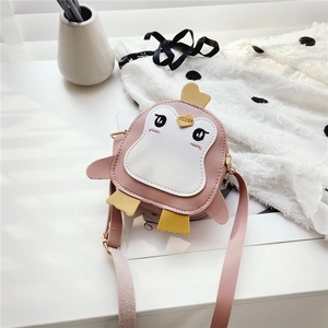 Detail of pink penguin kids crossbody bag featuring embroidery and golden zipper