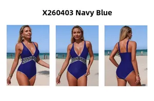 Navy blue one-piece swimsuit featuring deep V-neck, lace edges and geometric waist band
