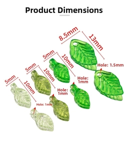Macro detail of green acrylic leaf charms in two sizes for DIY jewelry making