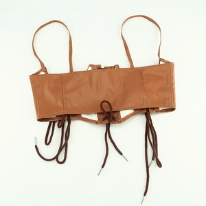 Detailed view of brown PU leather waist corset with thin straps and lace-up front detail