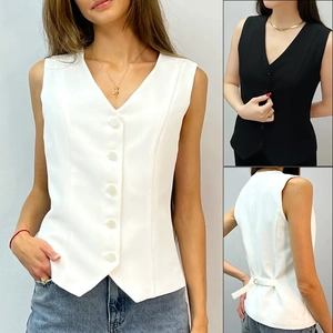 Detail of V-neck suit vest showing five-button front and adjustable back buckle