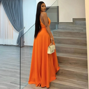 Elegant sleeveless orange halter maxi dress with gathered waist and ruffled hem