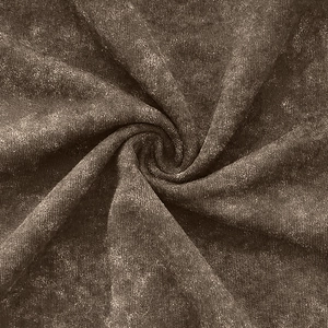 Detailed macro view of coffee-colored velvet fabric with acid wash effect and spiral pleats