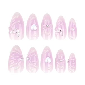 Short almond press-on nails in light purple with 3D floral, butterfly and heart accents
