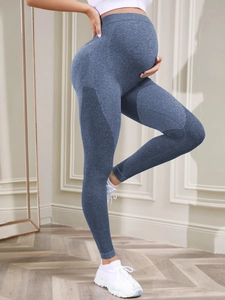 Detail of high waist seamless maternity yoga leggings in grey blue knit fabric