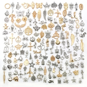 Mix of 150 gold and silver alloy charms in animal, leaf, and key shapes for DIY jewelry making