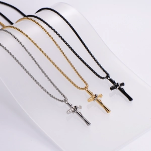 Three twisted cross pendant necklaces in silver, gold, and black with box chains