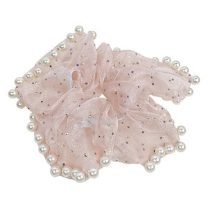 Pink mesh scrunchie with white pearls for elegant hair styling on white background