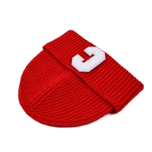 Red knit beanie for women with white C letter patch and warm ribbed winter texture