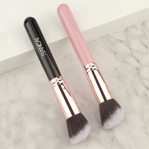 Angled foundation brush set with rose gold ferrules on elegant marble display
