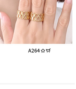 Close-up of wavy gold ring band with hollow design shown on finger for fit and style
