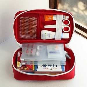 Portable large red emergency medical bag with multi-layer storage compartments for travel