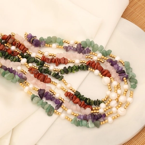Handmade necklace with natural green stones, white pearls, and golden stainless steel beads