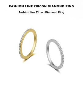 Detailed macro view of gold and silver minimalist stackable rings with pavé zircon settings