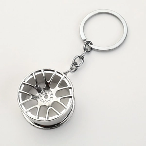 Silver multi-spoke metal car wheel hub keychain with polished mirror finish for car lovers