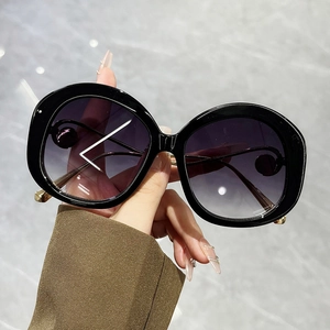 Vintage round frame sunglasses with pearl metal inlay and gradient purple lenses