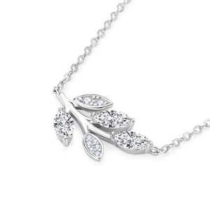 Macro shot of silver leaf pendant with marquise-cut marquise stones on a fine chain