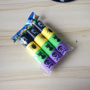 Detail of 6 plastic rainbow spring toys with Halloween prints in transparent packaging