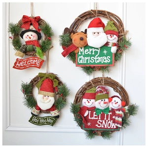 Close-up of rustic Christmas wreaths featuring plush Santa, Snowman, and Reindeer dolls