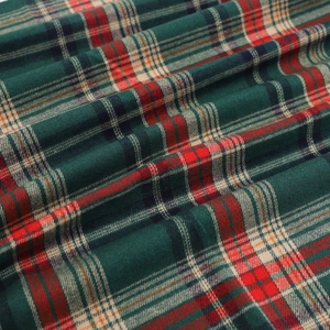 Deep green Christmas tartan fabric with red plaid pattern for festive gift box packaging