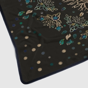 Close-up of flannel blanket showing Celtic leaf patterns and high-quality blue hem stitching