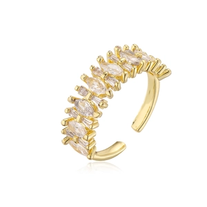 Detail of gold-plated geometric open ring with marquise and baguette cubic zirconia
