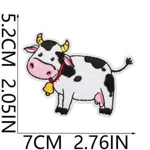 Detailed embroidery view of a cute cartoon cow patch with precise size measurements