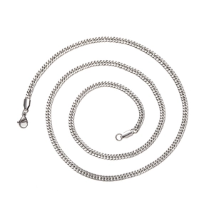 Macro view of 4mm silver stainless steel Cuban curb chain with lobster clasp and extension