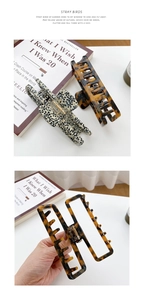 Detail view of large acetate hair claws in tortoiseshell and dalmatian dot patterns