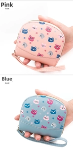 Detail of compact PU leather coin purses with bear prints in pink and blue versions