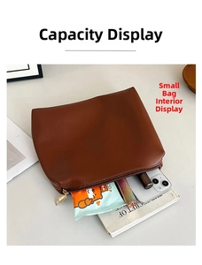 Internal view of brown faux leather pouch showing capacity for phone and cosmetics