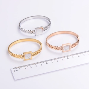 Three-color minimalist geometric hollow stainless steel bangle set with shell inlay