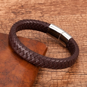 Close-up of brown braided leather bracelet with a silver stainless steel magnetic clasp