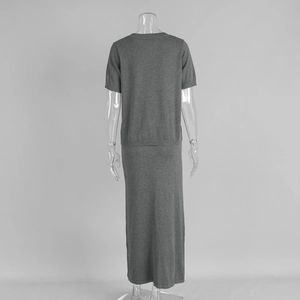 Rear view of grey knit two-piece set featuring short sleeve top and straight maxi skirt