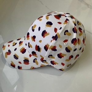 Unisex baseball cap with artistic red and purple graffiti patterns on white canvas fabric