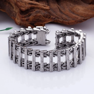 Detailed close-up of 316L stainless steel engraving on heavy punk style link bracelet