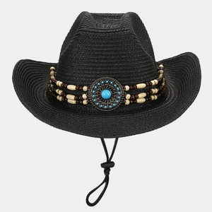 Detail of ethnic straw sun hat featuring beaded turquoise band and adjustable wind rope