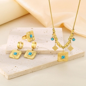 Set gioielli vintage placcato oro con pietre turchesi quadrate su base in pietra