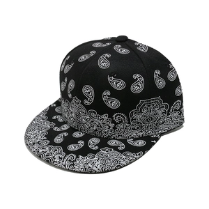 Flat brim snapback hat featuring black and white paisley pattern print for street style