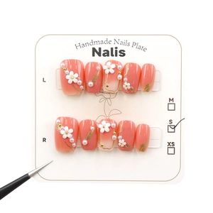 Pink gradient press-on nails with 3D white flowers and pearls in a 10-piece set