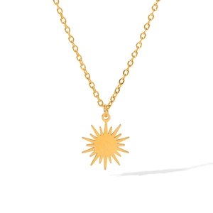 Close-up of a 18K gold-plated sunburst pendant necklace with a fine steel cable chain