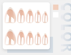 Detail view of 10-piece almond French tip press-on nails in peach pink and white