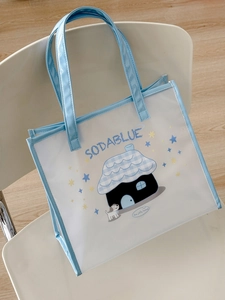 Detail of PVC tote bag with cute dog and house cartoon print and SODABLUE text design
