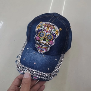 Dark blue denim baseball cap with colorful sugar skull embroidery and silver rhinestones